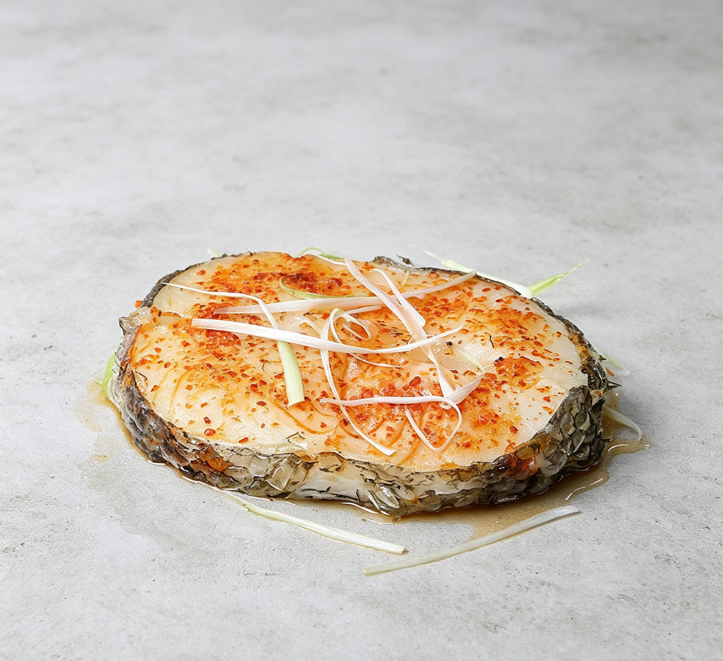 Savory Pan-Seared Fish Steak with Spices and Garnish